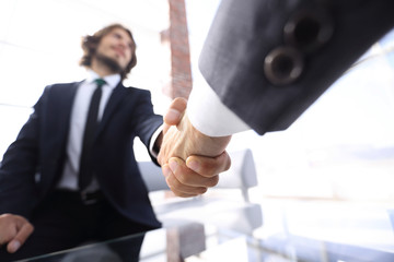 Close-up of two business people shaking hands