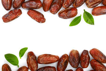 dry dates with green leaves isolated on white background with copy space for your text. Top view. Flat lay pattern