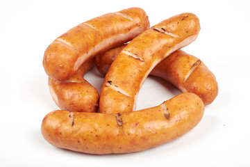 Grilled sausages isolated on a white background