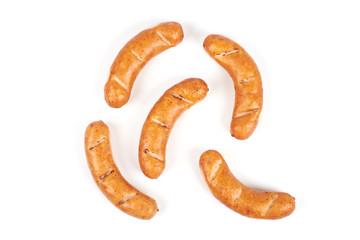 Grilled chicken sausages isolated on a white background