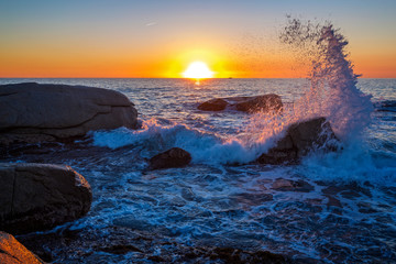 Beautiful sunrise in a bay with rocks in Costa Brava, Spain