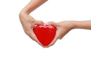 Obraz premium Hands holding small gift heart on Valentine's Day isolated on white background.