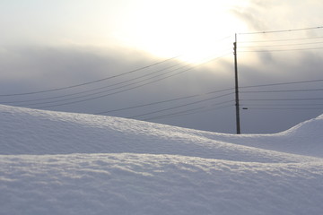 雪景色　太陽　電柱　電線　冬