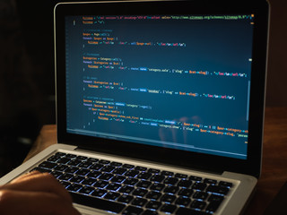 Computer code on laptop (web developing)