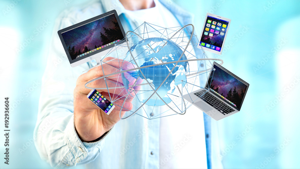Poster businessman holding a computer and devices displayed on a futuristic interface with international ne