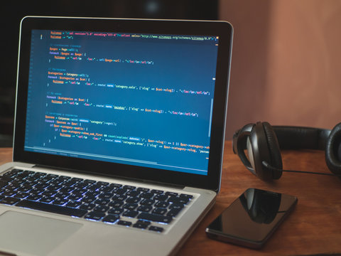 Computer code on laptop (web developing)
