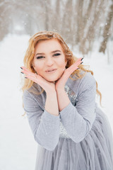 Beautiful girl  under the snowfall