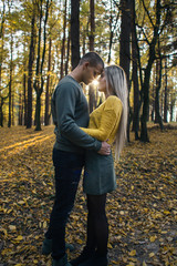 Fototapeta premium The lovely couple in love embracing in the park