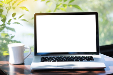 Fototapeta premium Laptop with blank screen on table. Workspace background new project on laptop computer with blank copy space screen for your advertising text message