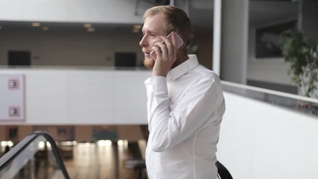businessman talking on the phone in the business center