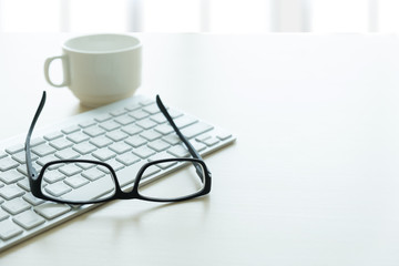 Close up of glasses and computer  business workplace work place in office