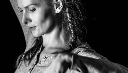 Portrait of beautiful woman dancing, black and white, high contrast.