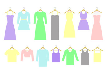 Collection of different dresses and shirts on hangers. Fashion women's wardrobe