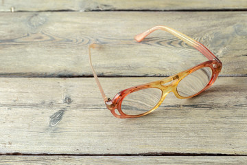 eyeglasses on wooden table