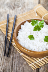 Boiled rice in a wooden bowl