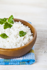 Boiled rice in a wooden bowl