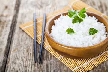 Boiled rice in a wooden bowl