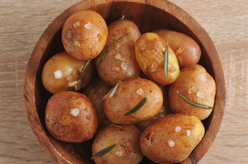 Mini-potatoes in a peel with garlic, rosemary and sea salt. View from above. Close-up. Macro photography.