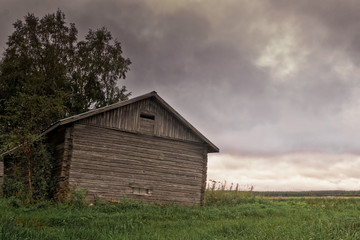 Dramatic Clouds Over The Barn House