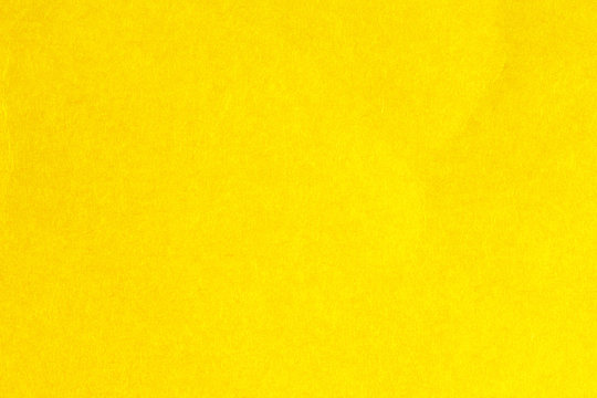 Yellow textured paper background 