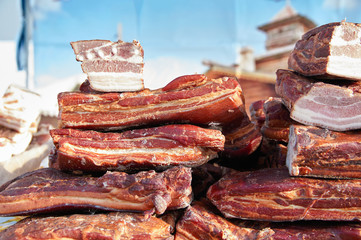 Smoked bacon with meat. Pile pieces smoked meat.