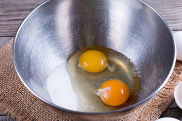 Cooking, whipping eggs with electric whisk in bowl