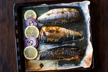 Mackerel Fish with Onions and Lemons in Baking Tray.