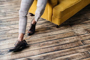 cropped view of elegant stylish man in brogue shoes