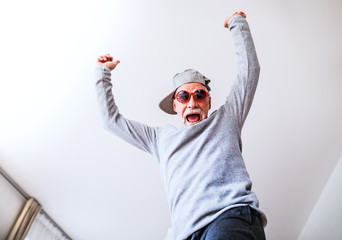 Senior man having fun at home.