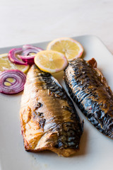Mackerel Fish with Onions and Lemons in Plate.