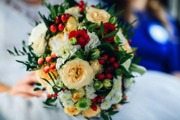 wedding beautiful bouquet with yellow roses and white chrysanthemums and green buds