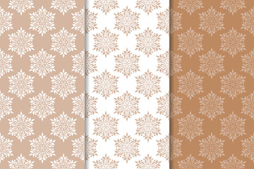 Fototapeta na wymiar Brown floral backgrounds. Set of seamless patterns