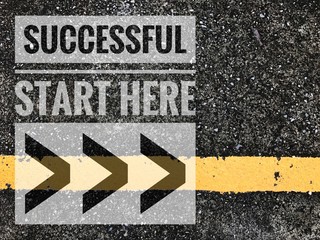 Successful start here words on Yellow line with asphalt road texture background. 