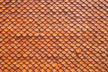 Orange color pattern tiles of temple roof © Mongkol