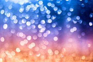 Defocused of light blue, pink and orange LED light on black background. Bokeh photo of LED light. Blue and amber. Teal and violet Bokeh. Cold and warm blurred contrasted photo.