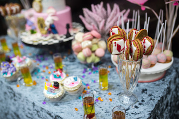 Candy cakes and other sweets on the table. Decor. Candybar.