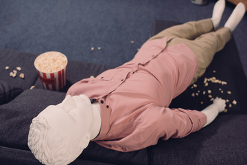 close up view of layman doll in casual clothing and popcorn