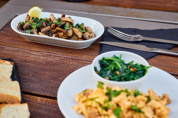 Snack from grated beans and greens, served with chopped mushrooms and seasoning, as well as slices of roasted homemade bread. Snack puree from legumes for spreading on toast.