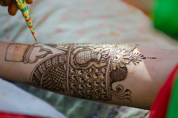 applying henna on hand, Hindu wedding ,Rajasthan, India