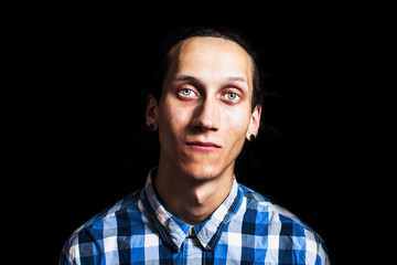 Portrait of young cool man with dreadlocks