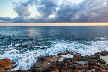fantastic stunning colorful landscape, sunset on the shore of the blue sea, the coast of Cyprus, the neighborhood of Paphos