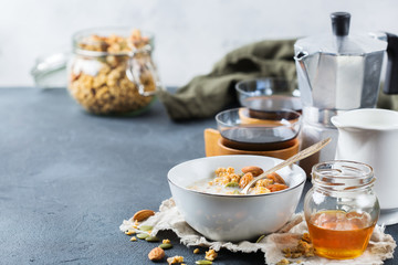 Breakfast with black coffee muesli granola honey nuts milk