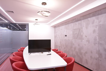 Office for meetings in the office. A large table for negotiations in the business center. A room for negotiations in the office of the company