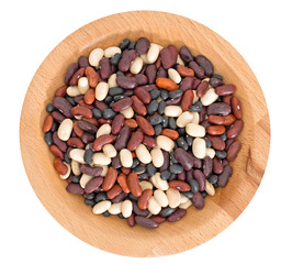 Dry beans in bowl, isolated on white.