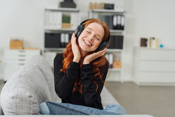 Young woman grinning with delight