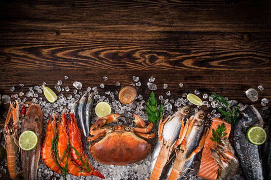 Fresh tasty seafood served on old wooden table.