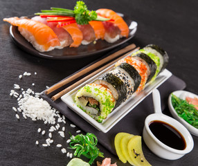 Japanese Sushi over black background.