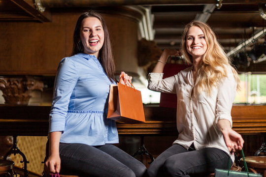 Cyber monday is the craziest day! Attractive girls made a lot of purchases for christmas
