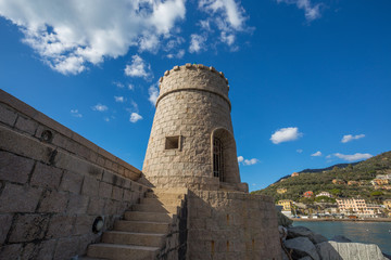 Fototapeta na wymiar View of the tower on the sea in the city of Recco , Genoa (Genova) Province, Liguria, Mediterranean coast, Italy