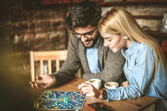 Young couple playing leisure games together.